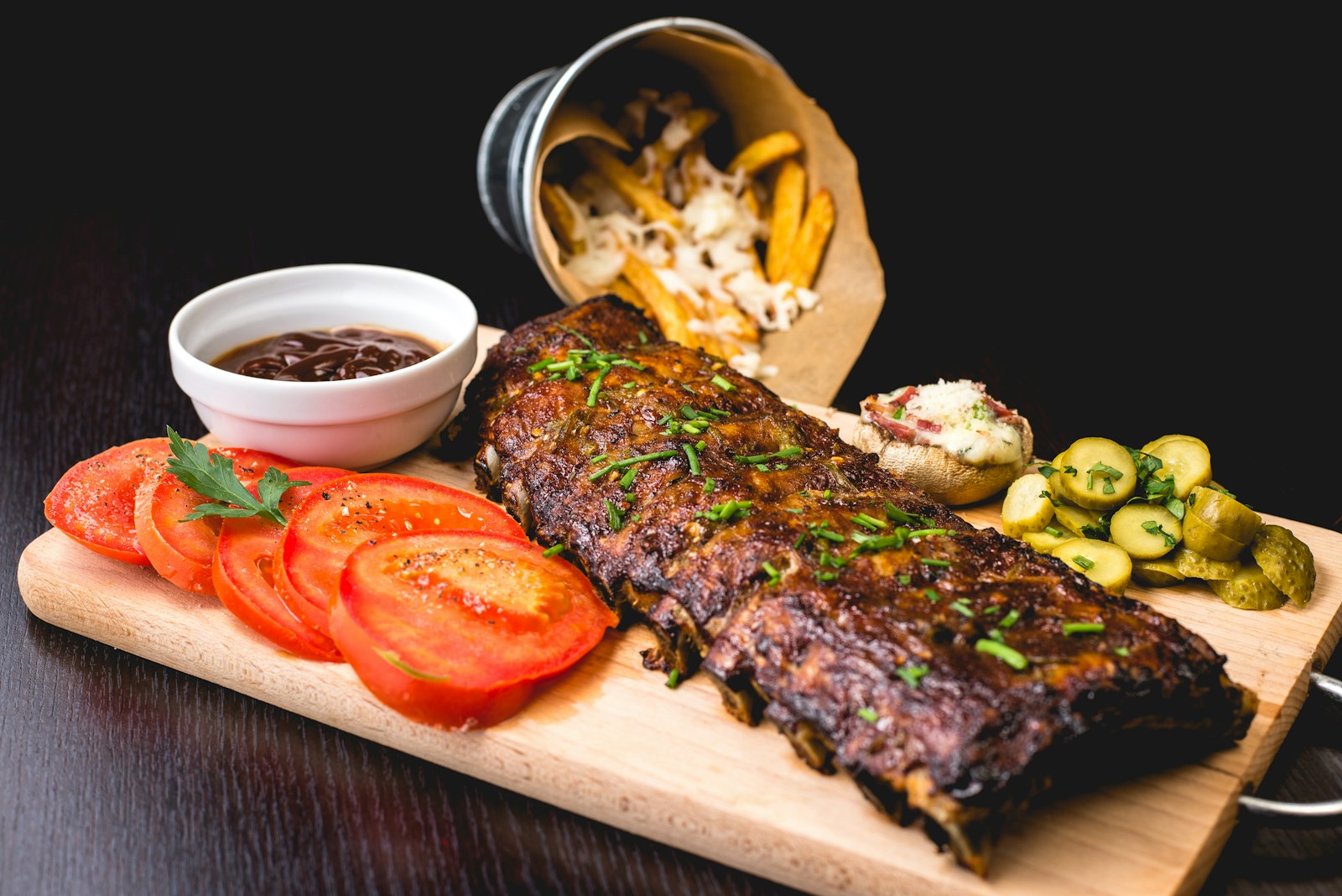 Barbecue ribs, fries and fresh sides